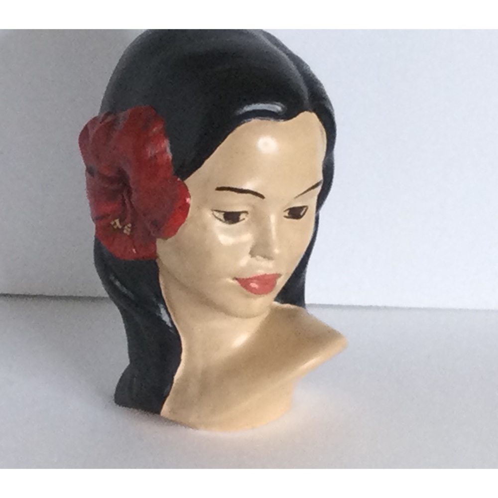 Vintage lady with red flower in her hair ceramic good condition.